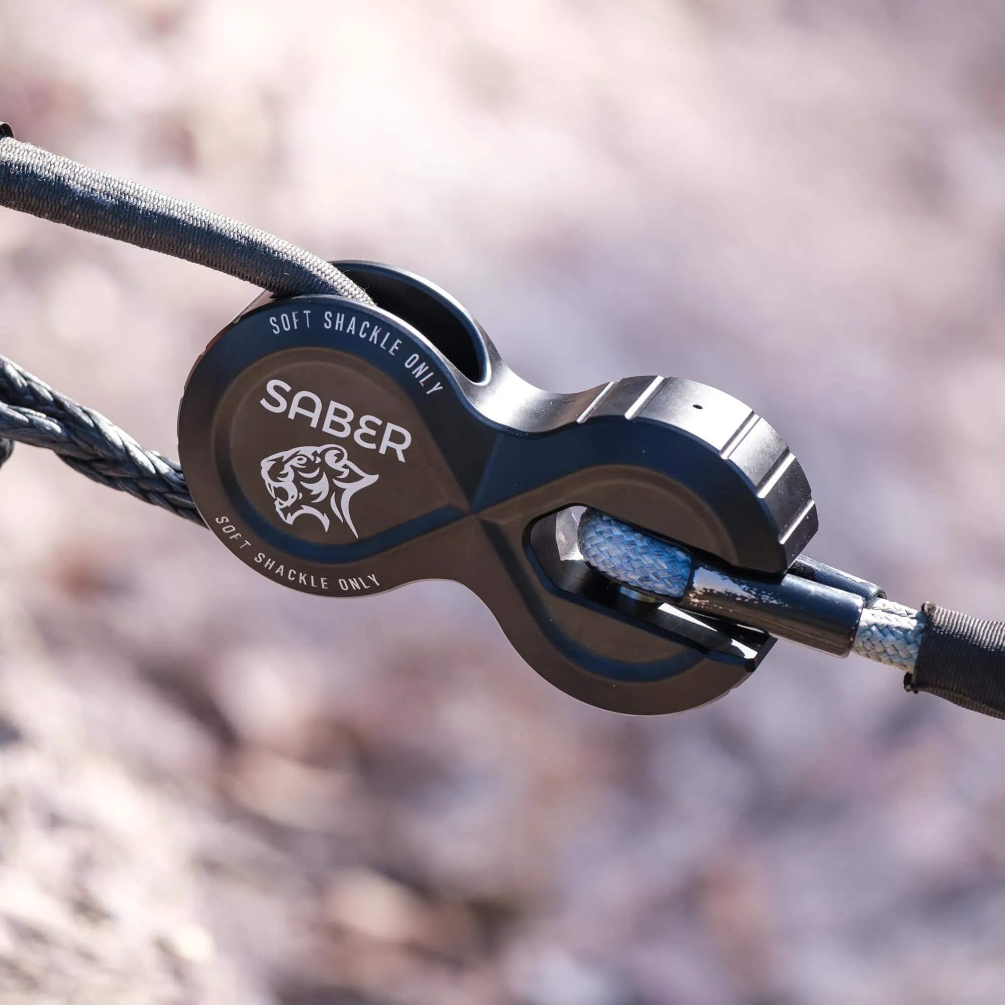 Close-up of the black Saber AWS Pro connecting a soft shackle to a winch rope