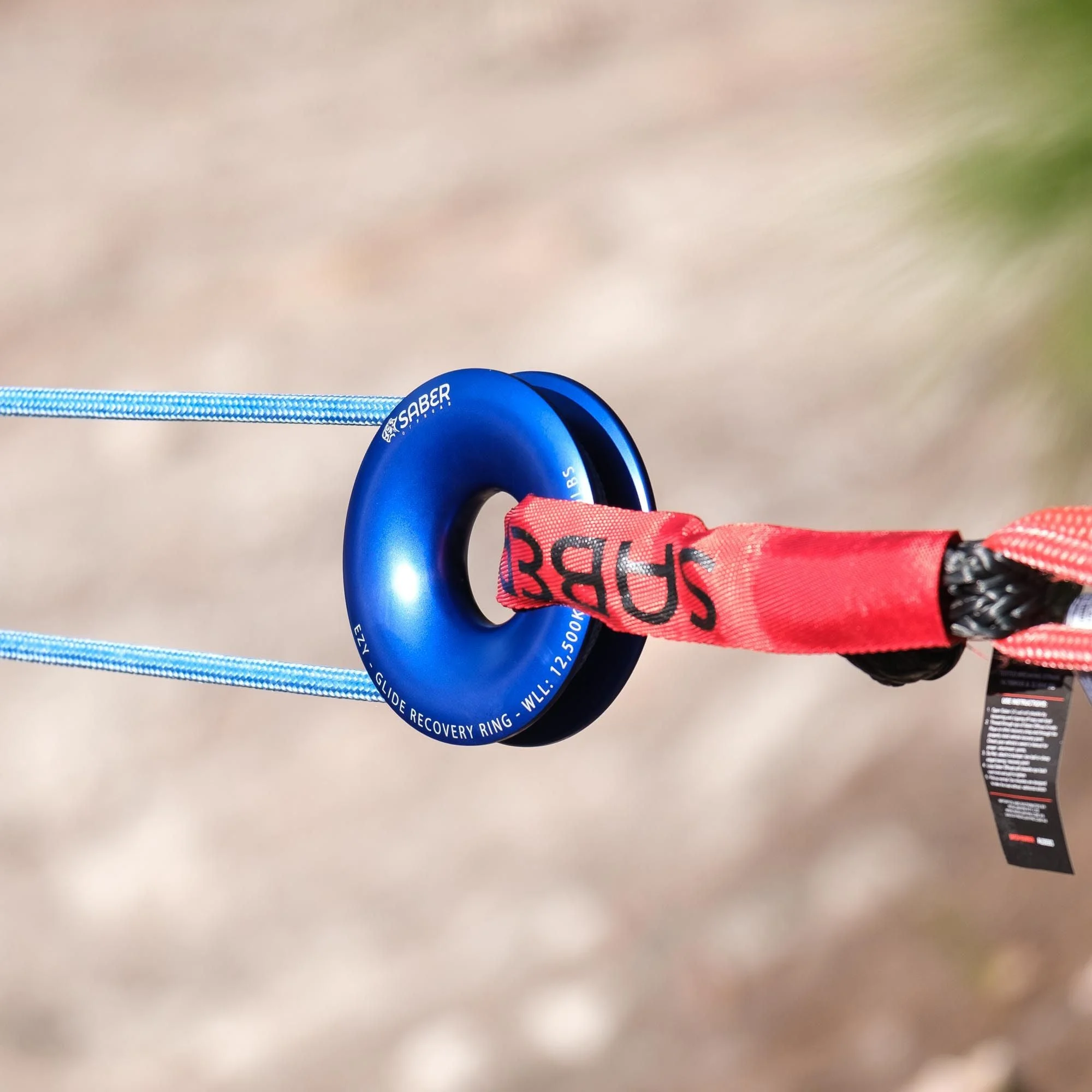 Saber Ezy-Glide recovery ring in blue with a red soft shackle attached, rigged between two lengths of light blue rope